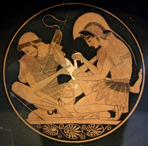تصویر 2. نمونه‌ای از نقاشی پزشکی در یونان باستان: به فیگورهای خطی و صاف دقت کنید: پزشک ارتشی در حال بستن زخم دست یک سرباز است.